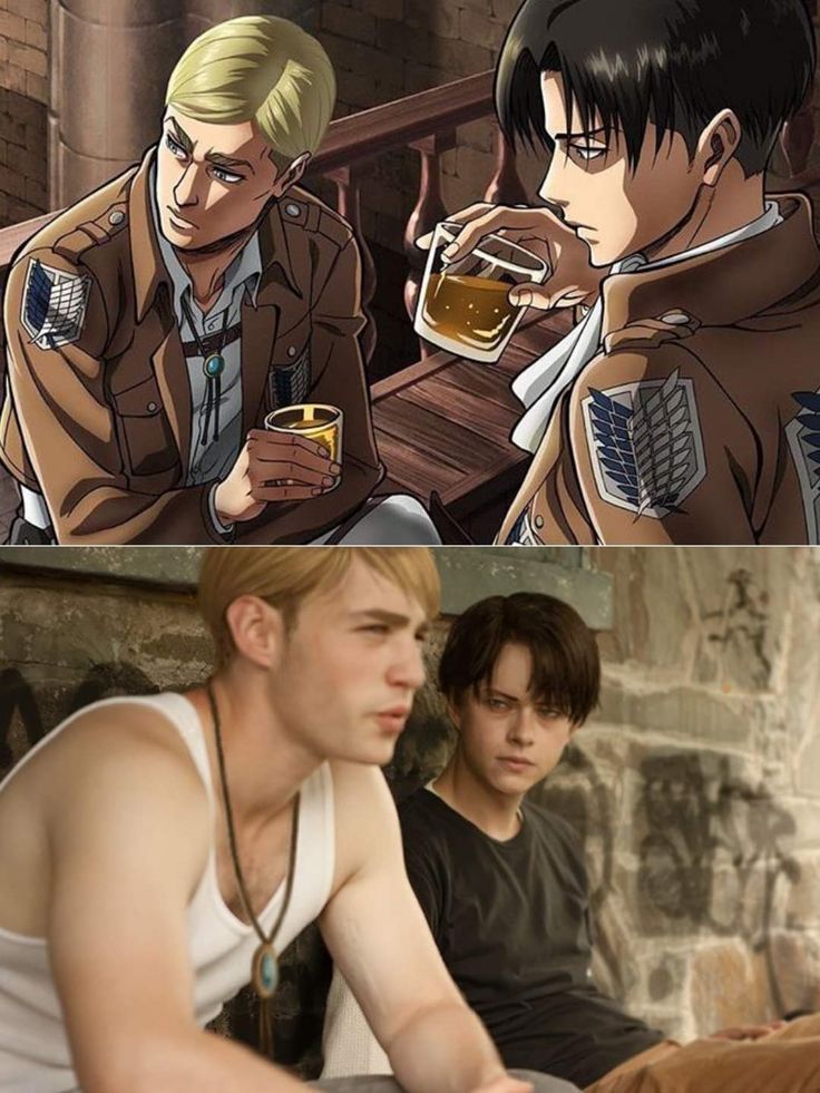 two men sitting next to each other drinking beer