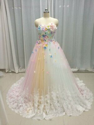 a dress with flowers on it is displayed in front of a mannequin's dummy