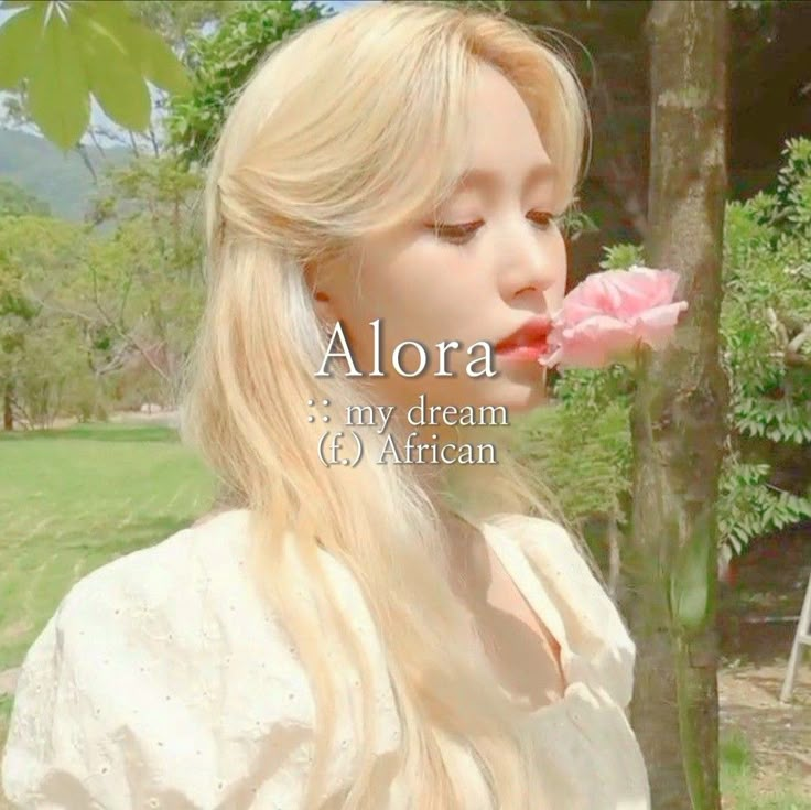 a woman with long blonde hair blowing on a flower in front of her face and the words alora my dream 6 african