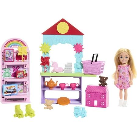 a doll house with furniture and accessories including a kitchen, dining area and play set