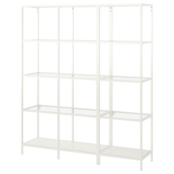 a white shelving unit with four shelves on each side and one shelf in the middle