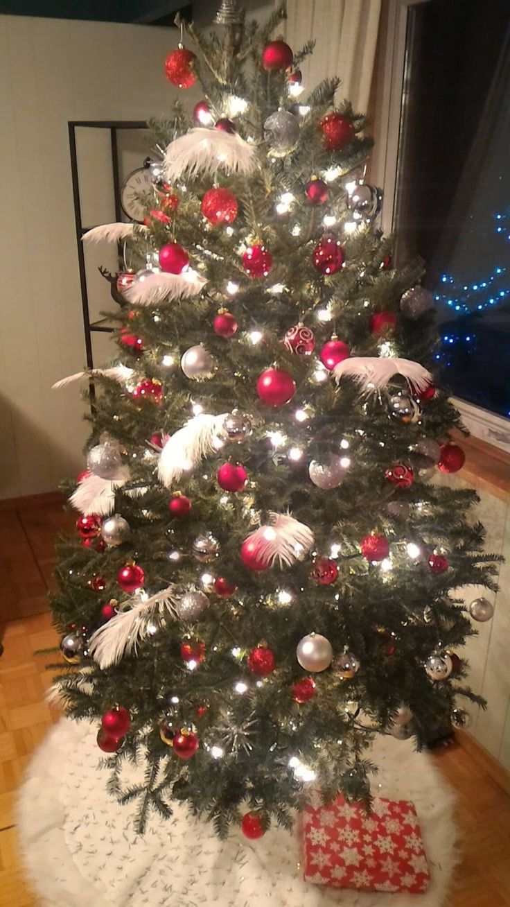 a christmas tree with red and white ornaments