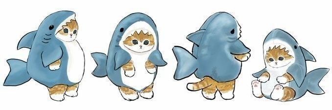 three cats in shark costumes are standing next to each other