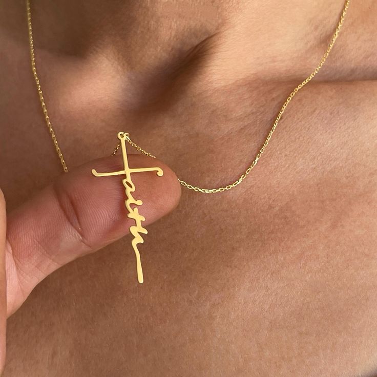 This 14k solid gold Faith necklace, featuring a unique cross-shaped design, combines elegance with deep spiritual meaning. Perfect for those who cherish their faith, this signature name necklace is both stylish and symbolic. Ideal as a Christian gift, it's perfect for wearing daily or gifting on special occasions to celebrate faith and devotion. Key Features: *Material: 14k solid gold *Customization: Laser engraving available *Craftsmanship: Handmade, made to order *Packaging: Ready to gift, comes in an elegant gift box *Design: Minimalist and timeless *Versatility: Suitable for everyday wear or special occasions Faith Necklace, Gift Box Design, Faith Gifts, Meaningful Jewelry, Christian Jewelry, Cool Necklaces, Religious Jewelry, Birthday Gifts For Women, Religious Gifts