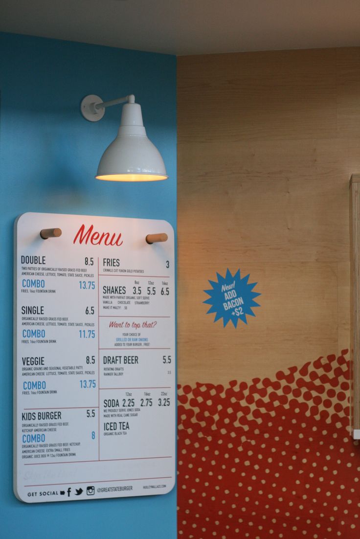 a restaurant menu hanging on the wall