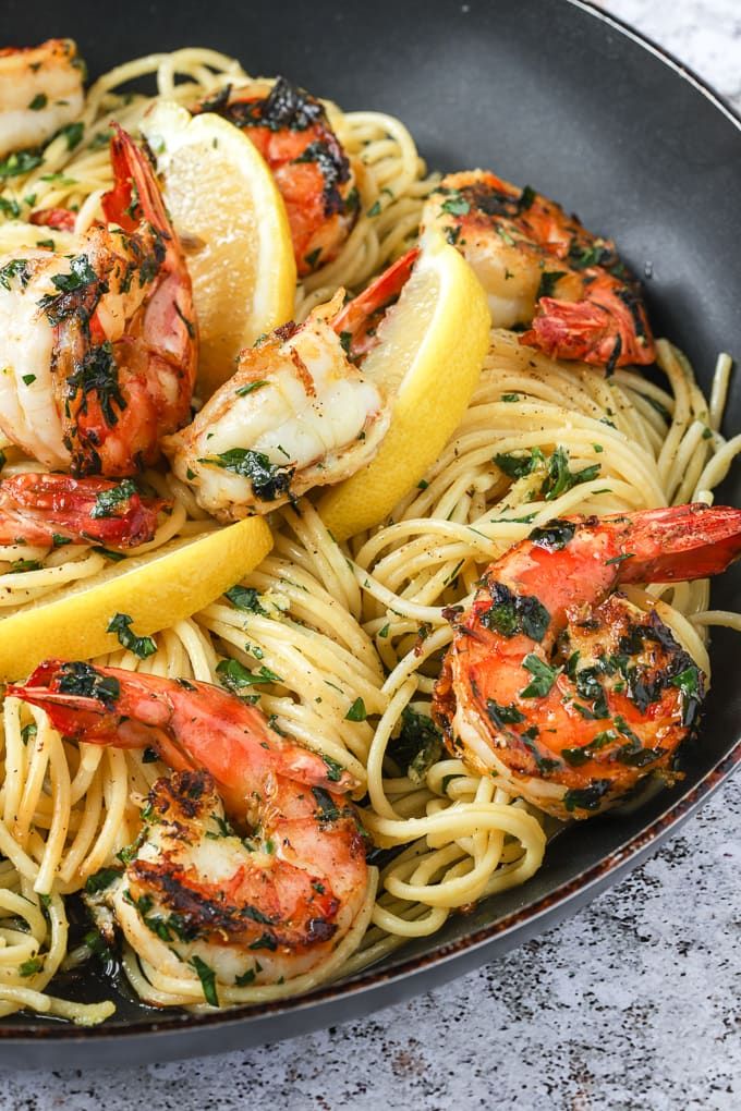 a pan filled with shrimp and lemon pasta