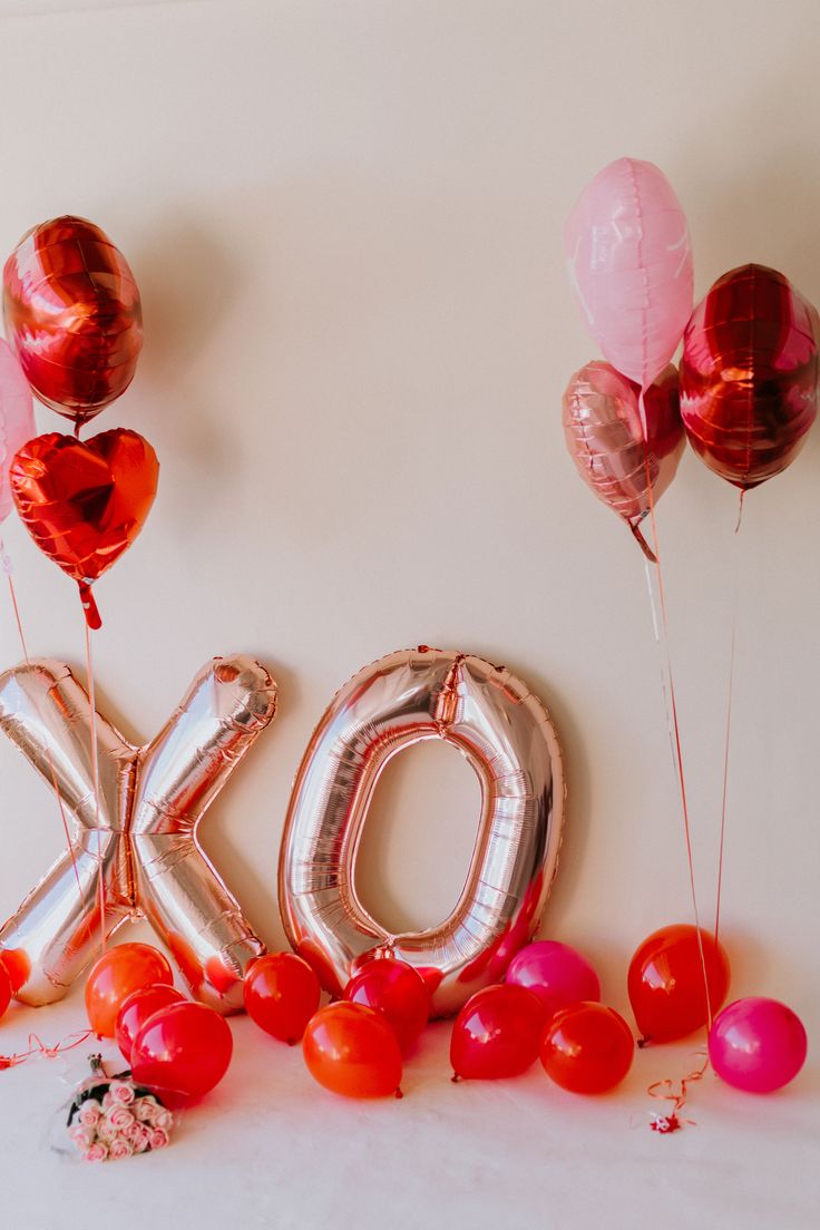 balloons and helium letters spelling out the word ok