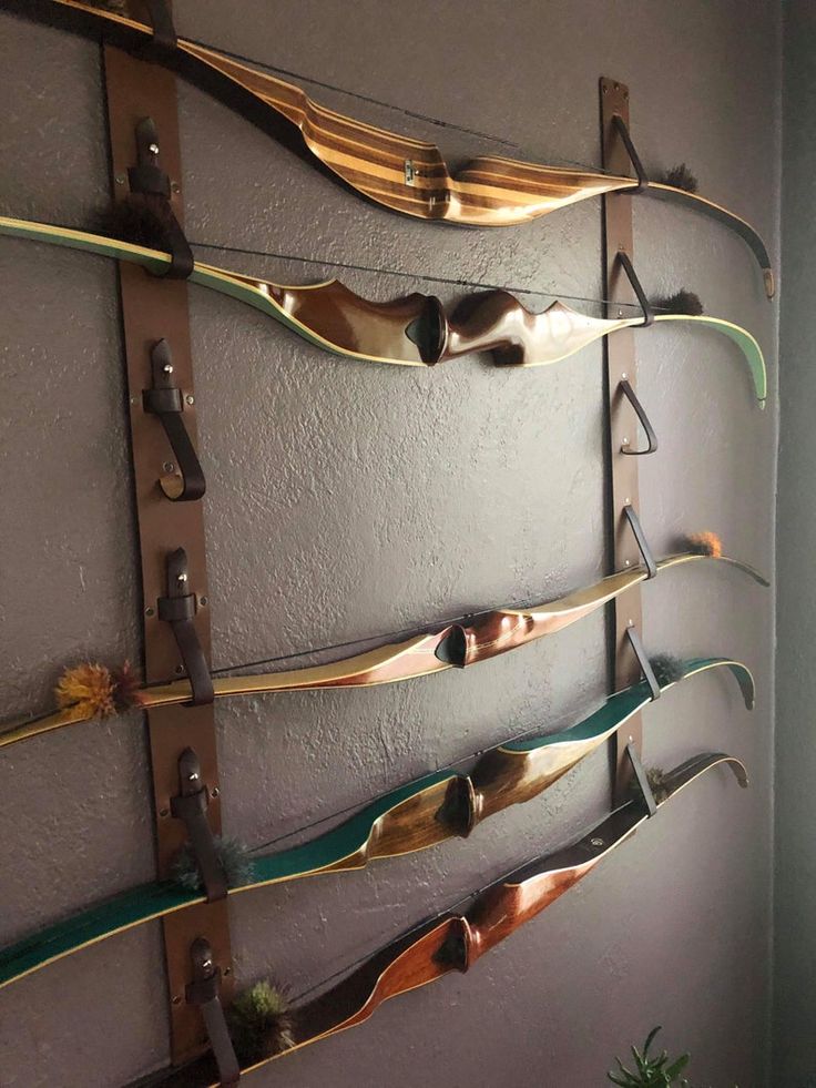 a wall mounted display with several metal objects on it