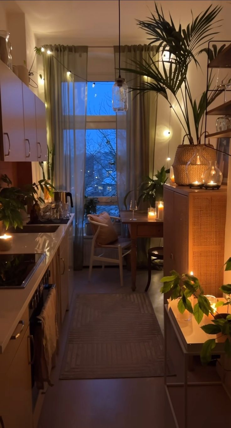 a kitchen filled with lots of counter top space next to a dining room table and chairs