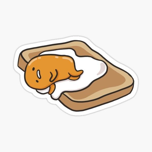 a piece of bread with an egg in it and a fish sticker on the side