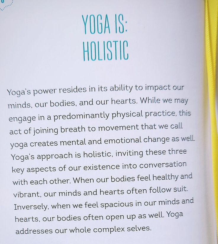 an open book with the words yoga is holstic written in white and green