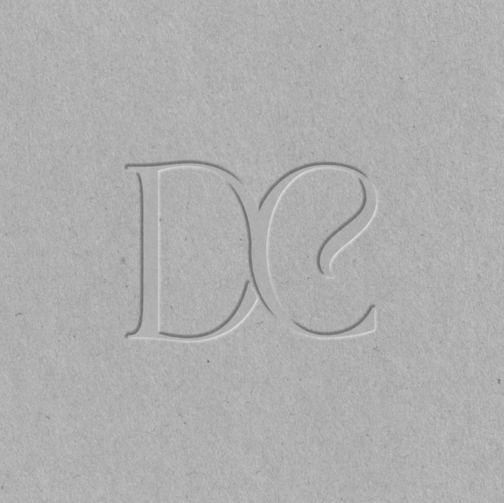 the letters d and s are made out of paper with some type of writing on it