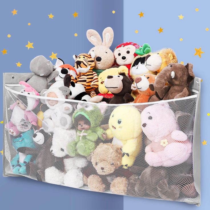 a bunch of stuffed animals are in a mesh bin with stars on the wall behind it