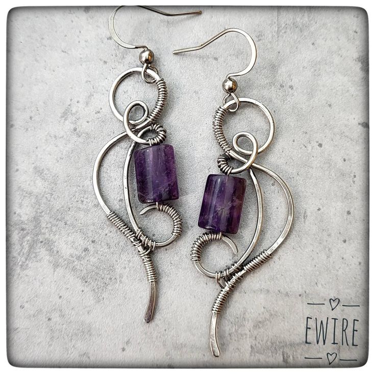 "The jewelry is delivered by Fedex, the delivery time is 3-4 working days! I bent these earrings from stainless steel wire. The wire type is 316L surgical metal wire. I decorated it with a 10 mm amethyste gemstone beads. The lever back closure is stainless steel, but not 316L. The high-gloss steel wire I use is a great alternative to silver wire.  It has a deeper gray color than silver.  However, this color is hereditary, does not change.  It does not oxidize, blacken, or discolor.  It gives a very stable jewelry shape.       Parameters: Total height appr.: 6 cm.(2.2\") I will send the jewel in bubble wrap or in a small box. You can find more earrings from me here: https://www.etsy.com/shop/EWirehu?ref=search_shop_redirect&section_id=28201898 Thank you for your visit!" Ear Wire Earrings, Unique Nickel-free Wire Earrings, Nickel-free Metal Wrap Earrings As Gift, Nickel Free Metal Wrap Earrings As Gift, Wire Wrapped Metal Drop Earrings, Metal Dangle Wrap Earrings As Gifts, Nickel-free Metal Wrap Earrings For Gift, Handmade Silver Wire Wrap Earrings, Pierced Dangle Earrings With Wire