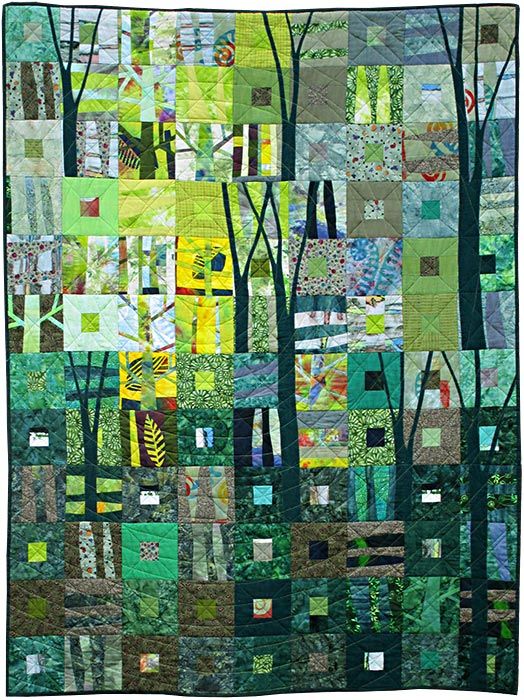 a patchwork quilt with trees and leaves in the background, all made up of different colors