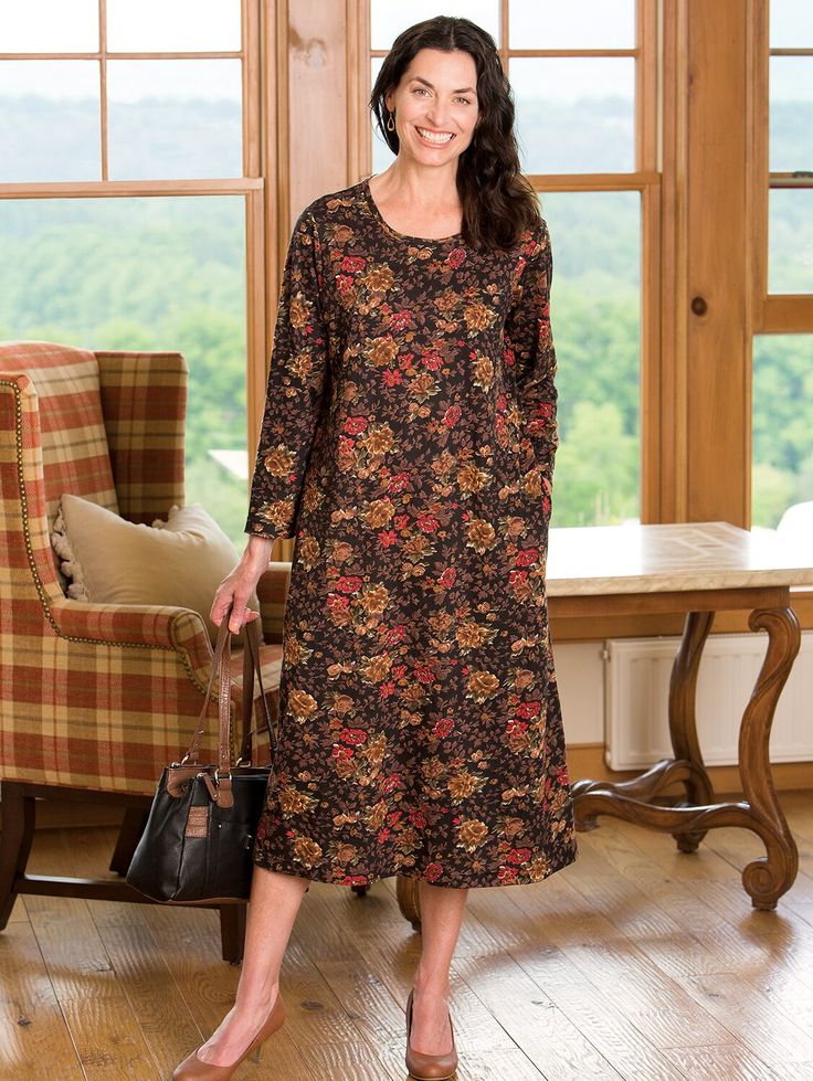 The next time you need to look dressed up but don't feel like getting dressed up, reach for this pretty floral dress. It's a soft cotton knit that feels like your favorite t-shirt and has simple, flattering lines and an easy A-line silhouette. The floral pattern elevates the look of this dress, making it a great choice for special occasions, too. This item runs large; please order accordingly to ensure the best fit. Easy, relaxed fit Pullover style Scoop neckline Side seam pockets Resists wrinkles; great for travel Approx. 47" long 100% cotton knit Machine wash, line dry Imported Exclusive to The Vermont Country Store | Floral Cotton Knit A-Line Dress - Brown Blossom - Large - The Vermont Country Store Pretty Floral Dress, Vermont Country Store, Knit Machine, Floral Knit, Country Store, General Store, Cotton Knit, Get Dressed, Vermont