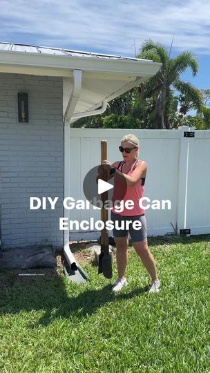 a woman holding a baseball bat in front of a house with the words diy garage can enclosure