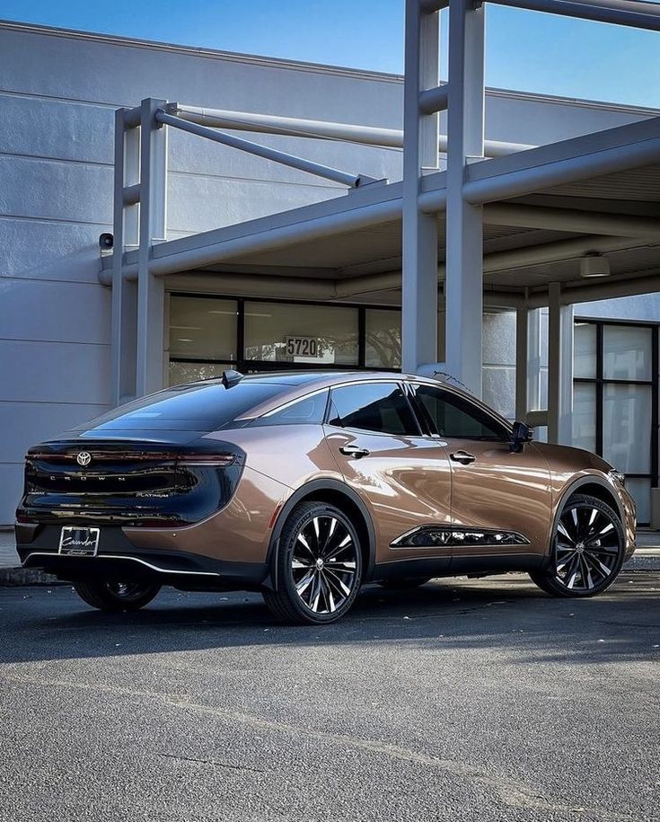 a silver car parked in front of a building