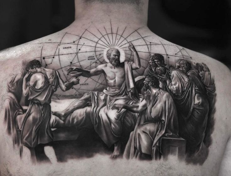 the back of a man's neck with an image of jesus and other people on it