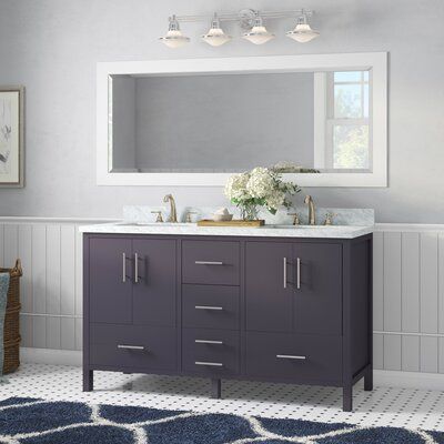 a bathroom with a sink, mirror and rug