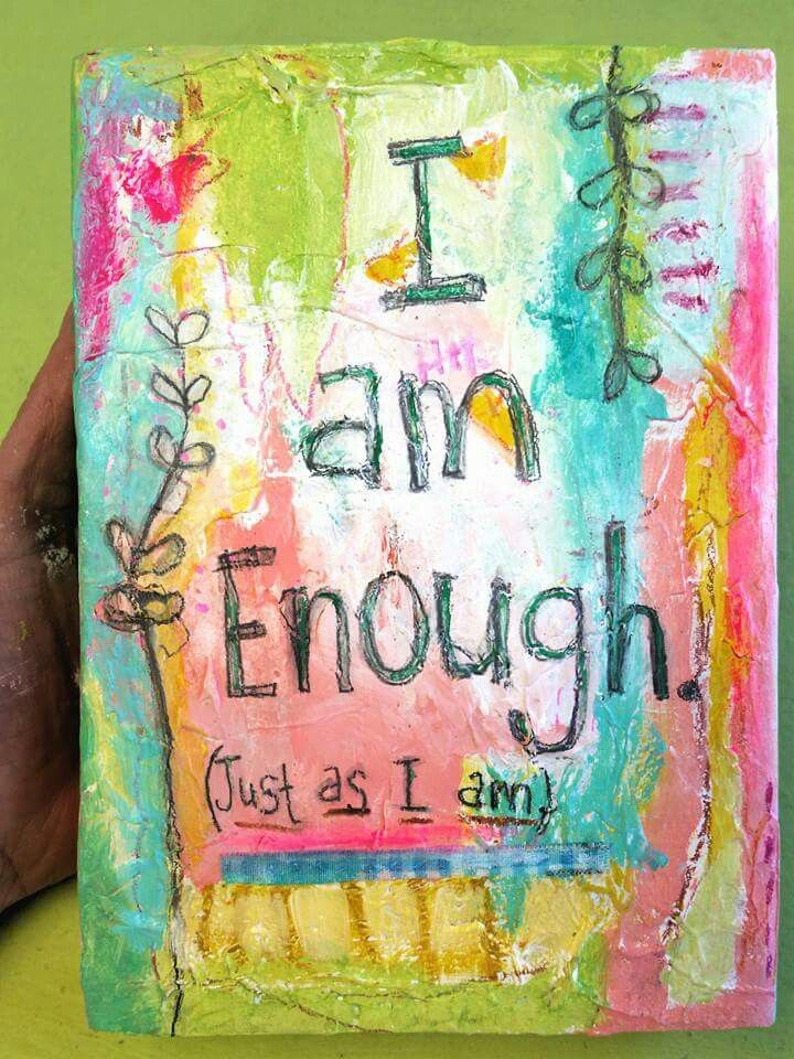 someone is holding up a painting with words on it that read i am enough just as i am