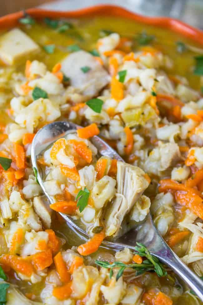 a bowl filled with chicken and rice soup