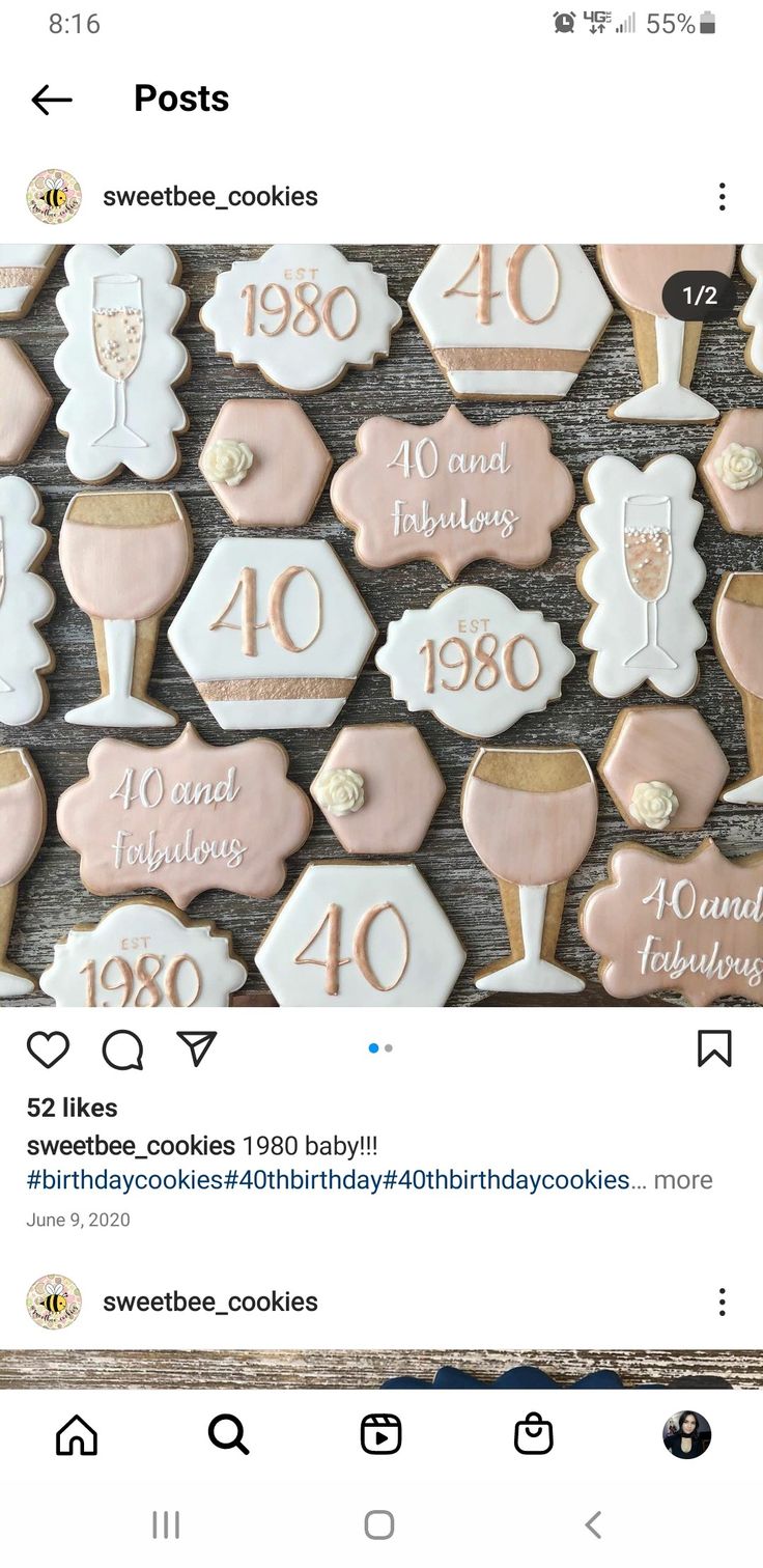 cookies decorated with pink icing and white frosting are displayed in front of a wooden background