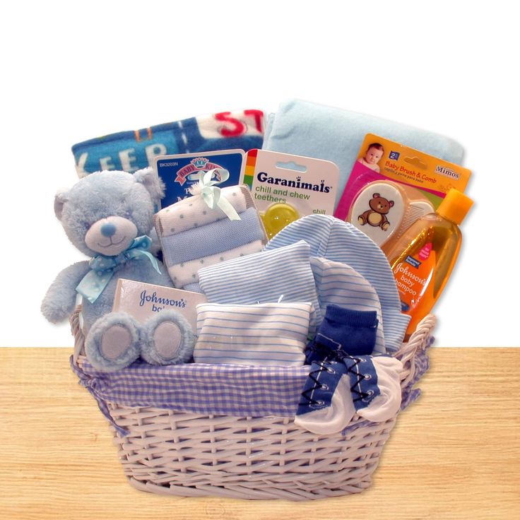 a white basket filled with lots of baby items