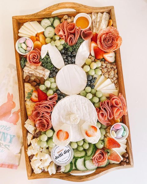 a wooden tray filled with different types of food