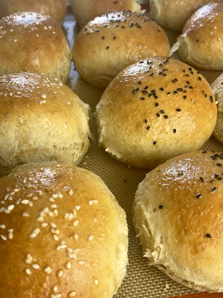 bread rolls with sesame seeds and seasoning sprinkled on them