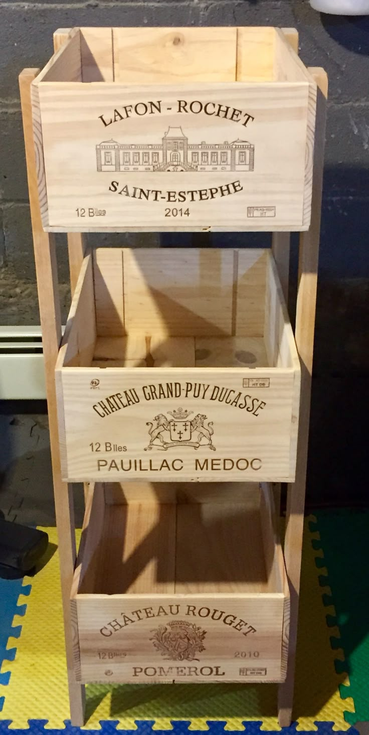 three wooden crates stacked on top of each other