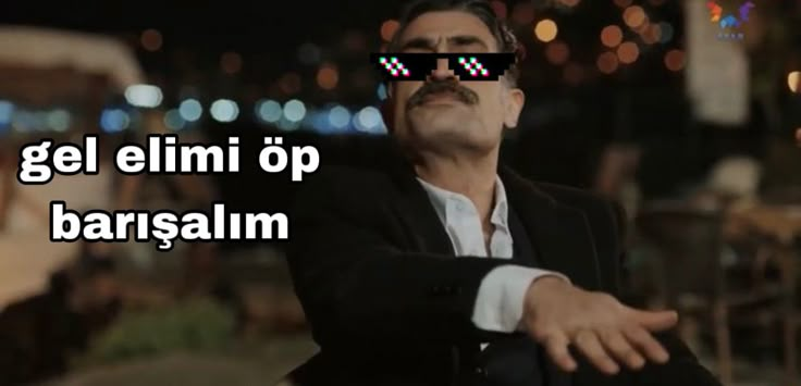 a man wearing sunglasses with the words gel elmi op barsalm