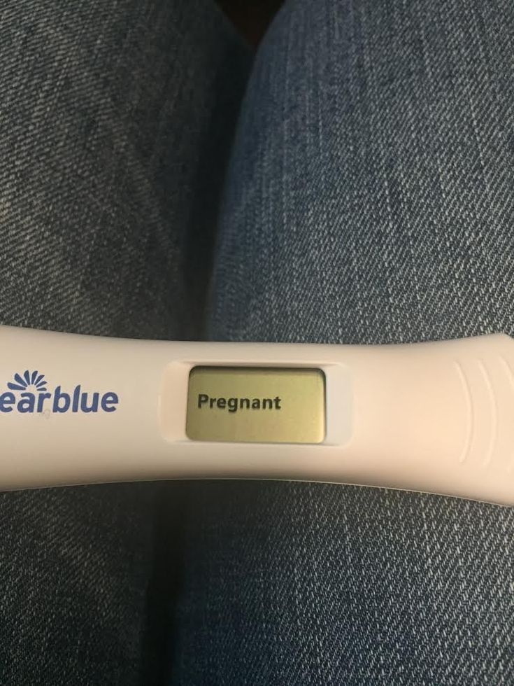 an electronic thermometer is on top of a blue seat with white writing that reads, dearblue pregnant