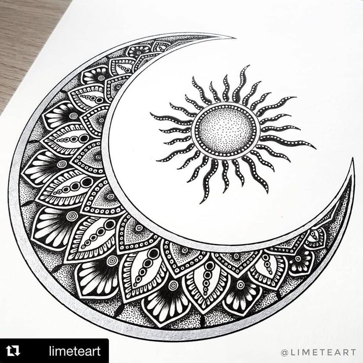 a drawing of a sun and moon with intricate designs on it's side, sitting on top of a piece of paper