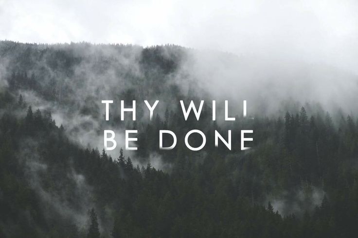 the words, thy will be donee are in front of a mountain covered with fog