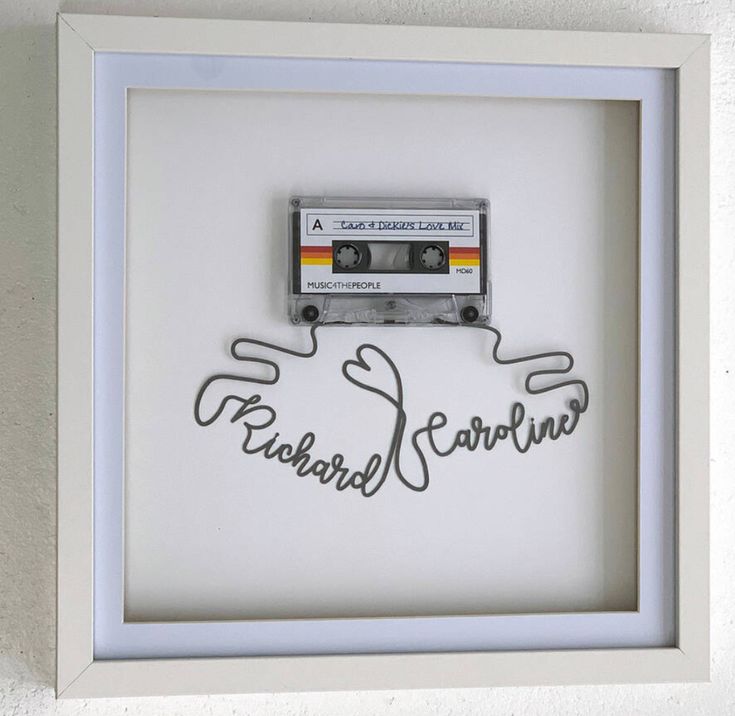 a white frame with a tape recorder in it