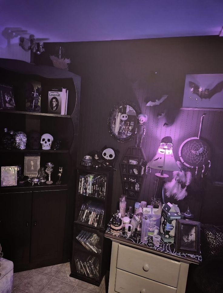 a room filled with lots of halloween decorations and decor on the walls, including shelves