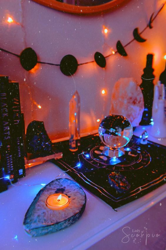 a stove top oven sitting on top of a counter next to a candle and bottles