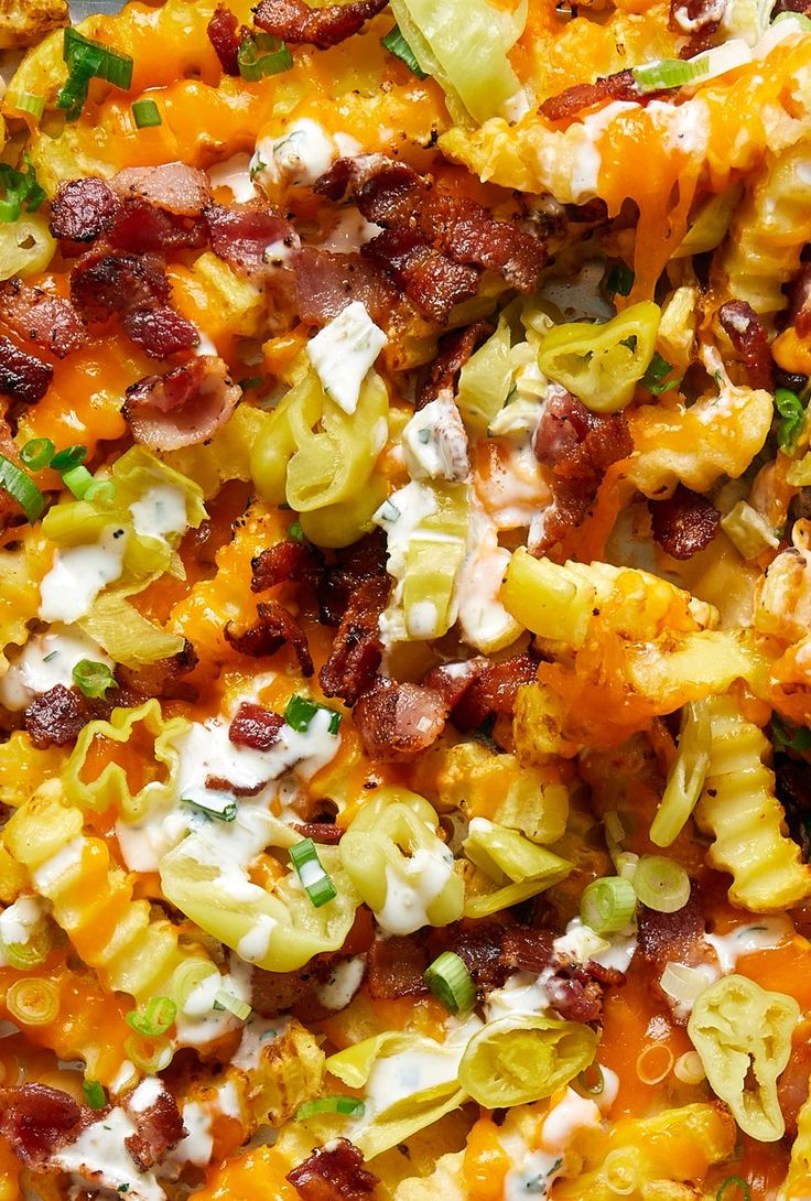 a close up view of some food with cheese and other toppings on the top