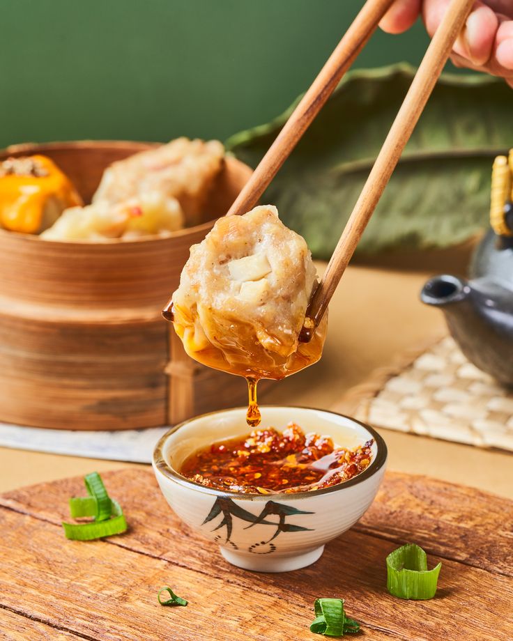 chopsticks lifting up food from a bowl