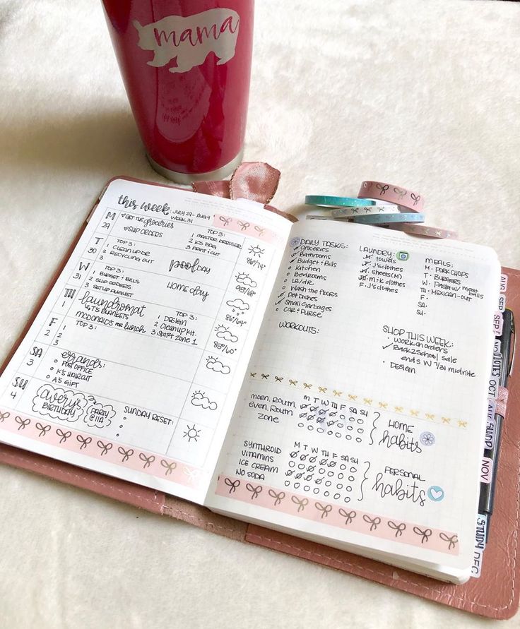 a pink planner with the words mama written on it and a cup of coffee next to it