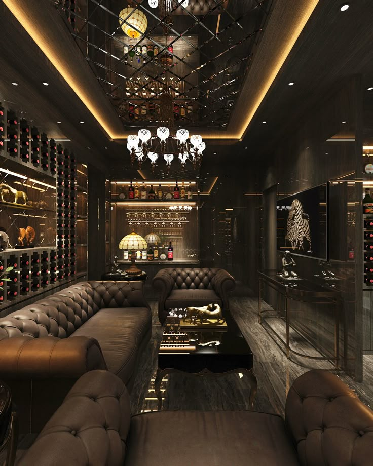 a room with couches, wine bottles and chandeliers