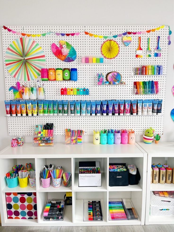 a white shelf filled with lots of craft supplies