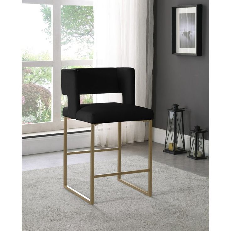 a black bar stool in front of a window