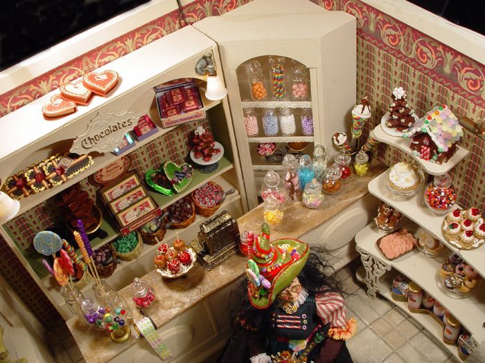 an aerial view of a dollhouse kitchen with lots of food on the counter and shelves