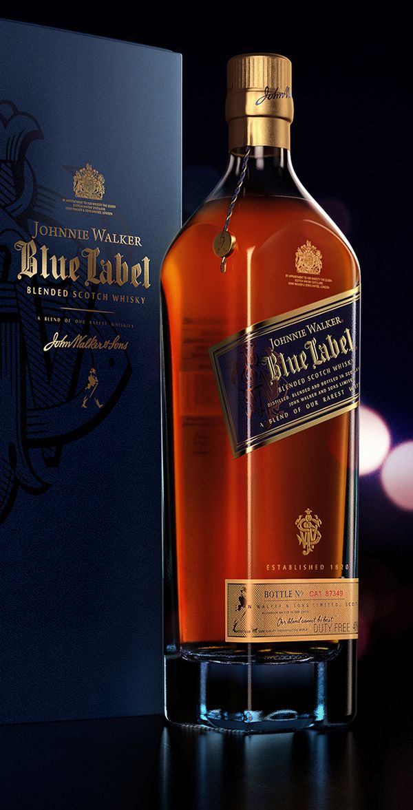 a bottle of blue label whisky sitting next to a box