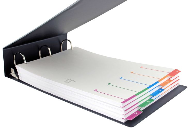 a binder that is open and stacked on top of each other, with several folders attached to it