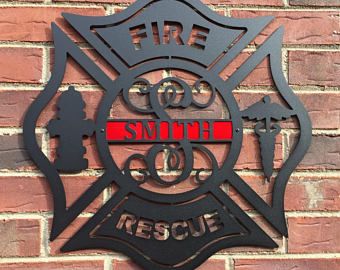 a fire department emblem on a brick wall