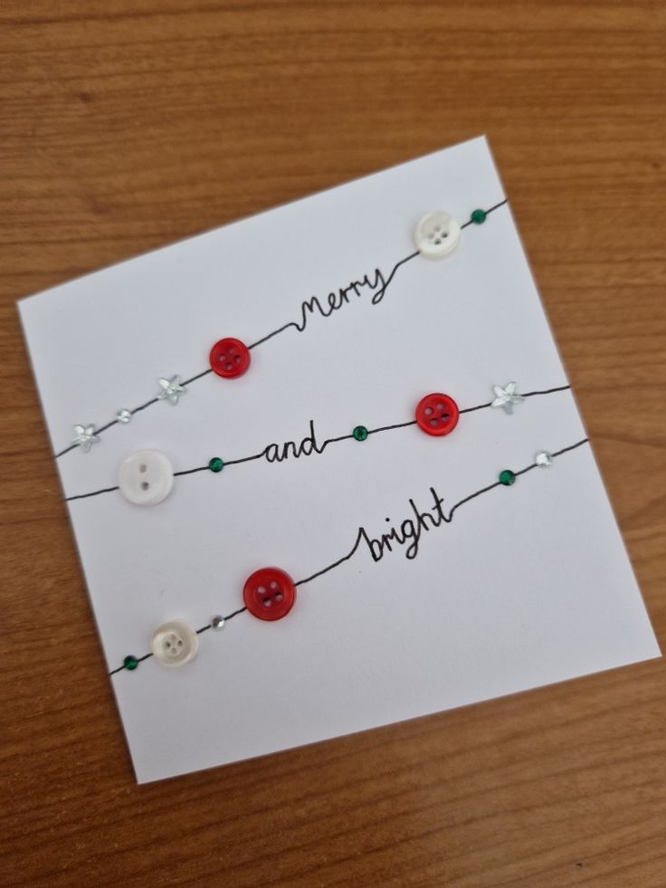 a card with some buttons on it and the words merry and bright written in black ink