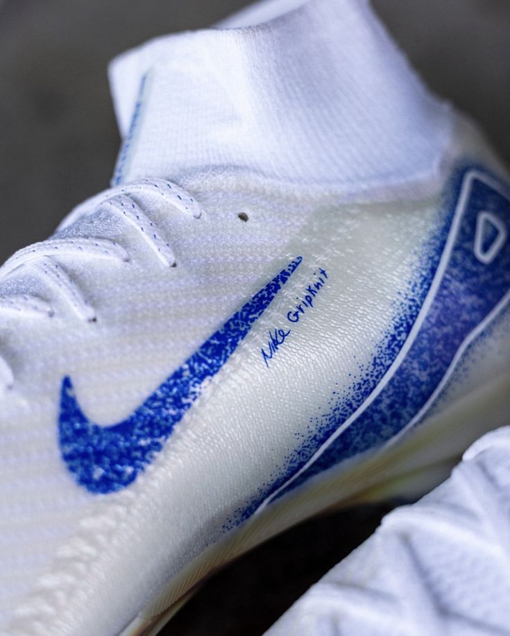 the nike shoe is white and blue